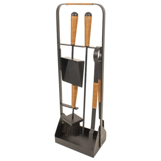 Set of fireplace tools including a poker, brush, and shovel on a stand with wooden handles.